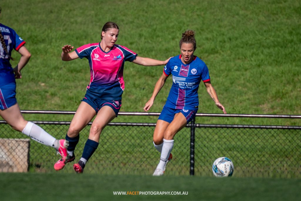 Caitlin Jarvie shields the ball from an opponent during a trial game between Manly United and Illawarra Stingrays. Photo credit: Jeremy Denham