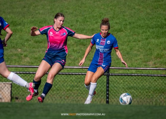 Caitlin Jarvie shields the ball from an opponent during a trial game between Manly United and Illawarra Stingrays. Photo credit: Jeremy Denham