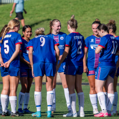 Manly United have a pre-match huddle before their trial game against Illawarra Stingrays. Photo credit: Jeremy Denham