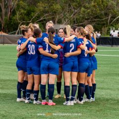 Manly United huddle before their NPL NSW Women's Round 3 game against Gladesville Ravens at Christie Park. Photo credit: Jeremy Denham