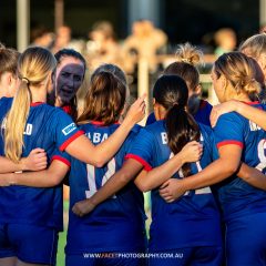 The Manly United Women's 1st grade team huddle before their 2023 NPL NSW Women's Round 6 game against Northern Tigers at Cromer Park. Photo credit: Jeremy Denham