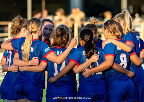 The Manly United Women's 1st grade team huddle before their 2023 NPL NSW Women's Round 6 game against Northern Tigers at Cromer Park. Photo credit: Jeremy Denham