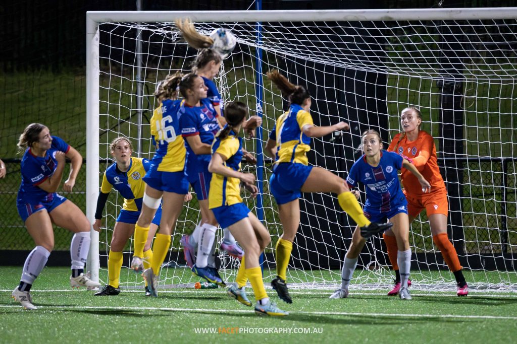 Manly United forward Emily Minett heads in the opening goal during the 2023 Round 8 NPL NSW Women's game between Manly and Sydney University. Photo credit: Jeremy Denham