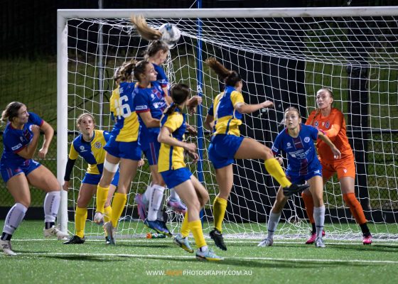 Manly United forward Emily Minett heads in the opening goal during the 2023 Round 8 NPL NSW Women's game between Manly and Sydney University. Photo credit: Jeremy Denham