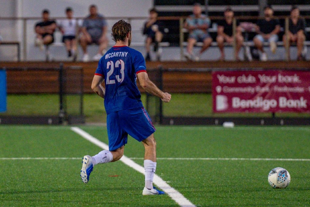 Action shot of Harry McCarthy during the 2023 NPL NSW Men's Round 2 game between Manly United and Sydney Olympic. Photo credit: Jeremy Denham