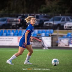 Ruby Jackson looks for options during the 2023 NPL NSW Women's Round 16 game between Manly United and Gladesville Ravens at Cromer Park. Photo credit: Jeremy Denham