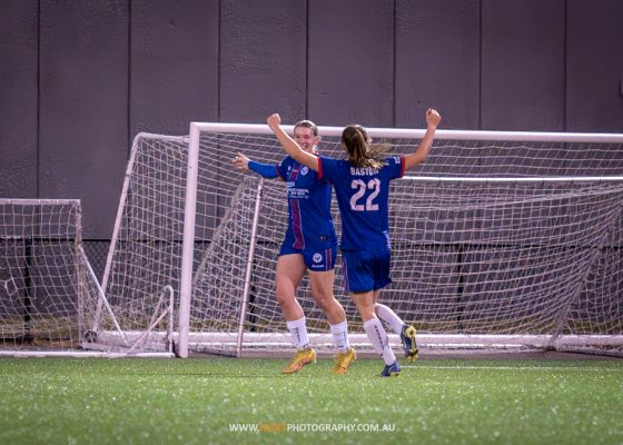 Kahli Johnson celebrates her goal with Emily Bastow, during the 2023 NPL NSW Women's Round 18 game between Manly United and APIA Leichhardt at Cromer Park. Photo credit: Jeremy Denham