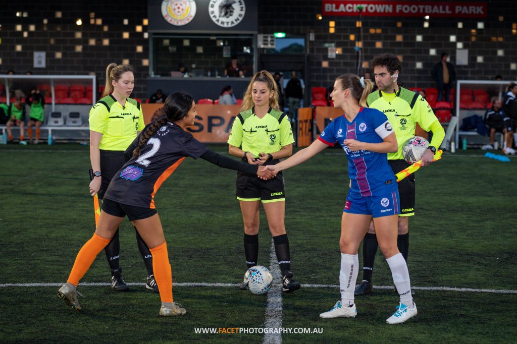 Chantelle Maniti (left) and Ruby Jackson (right) shake hands before the 2023 NPL NSW Women's Round 13 game between Blacktown Spartans and Manly United at Blacktown Football Park. Photo credit: Jeremy Denham