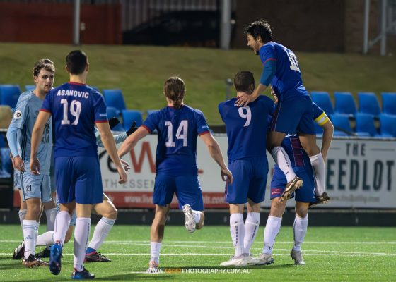 Manly United celebrate Jimmy Oates' goal during their 2023 NPL NSW Men's game against Sutherland Sharks, played at Cromer Park. Photo credit: Jeremy Denham