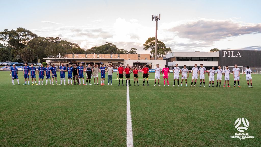 The teams line up before the 2024 Round 9 NPL Men's NSW game between Manly United and Western Sydney Wanderers, played at Cromer Park on April 7, 2024. Photo credit: Jeremy Denham for Football NSW