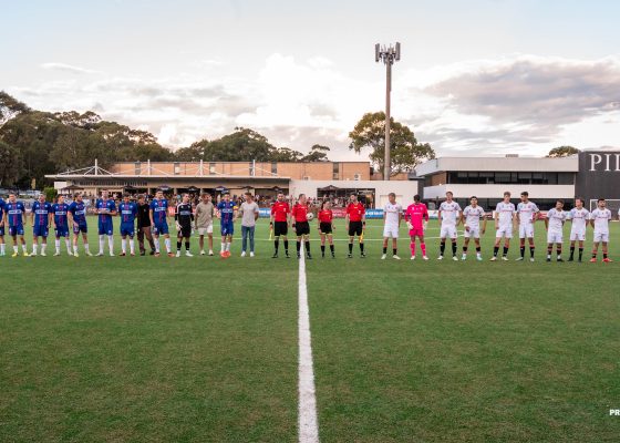 The teams line up before the 2024 Round 9 NPL Men's NSW game between Manly United and Western Sydney Wanderers, played at Cromer Park on April 7, 2024. Photo credit: Jeremy Denham for Football NSW